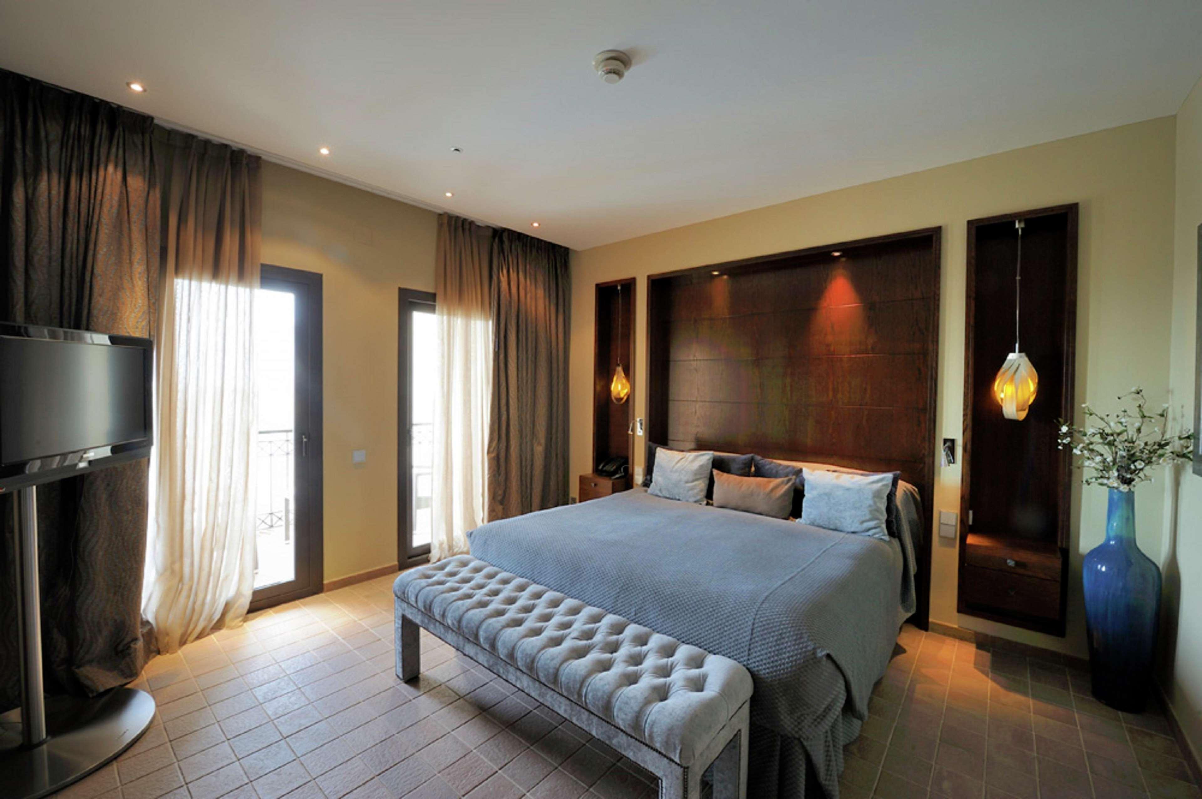 Doubletree By Hilton La Torre Golf Resort Roldan Екстер'єр фото A bedroom at the hotel