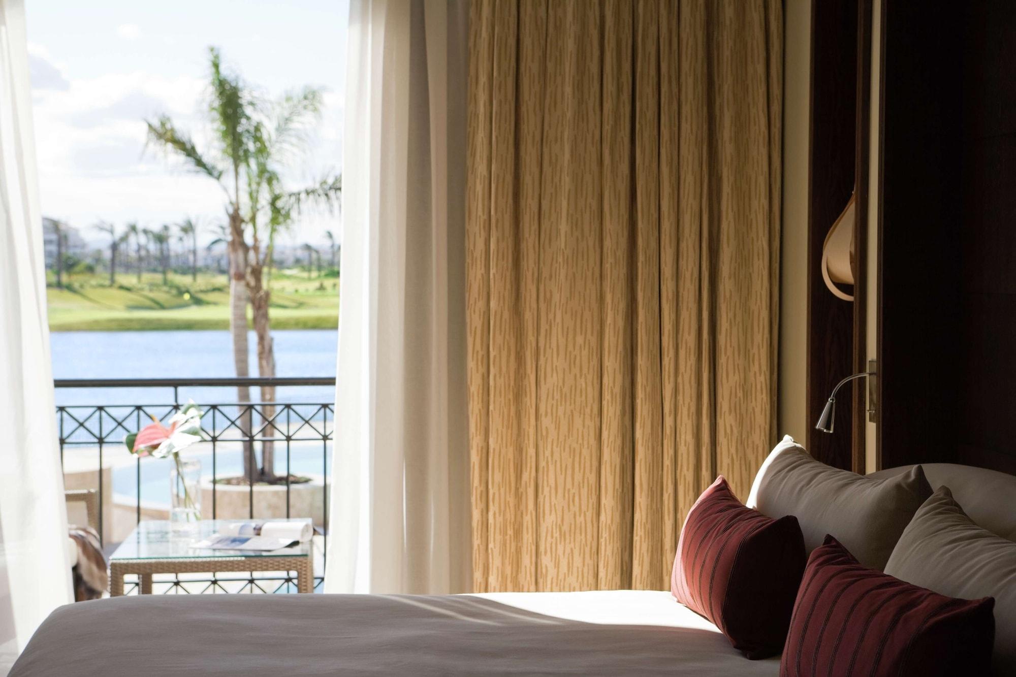 Doubletree By Hilton La Torre Golf Resort Roldan Екстер'єр фото A bedroom at the resort